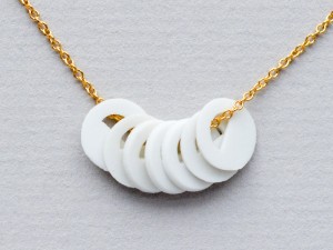 7 White Porcelain Circles on a Gold Chain
